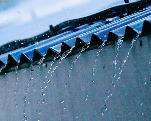 gray-roof-sheets-with-water