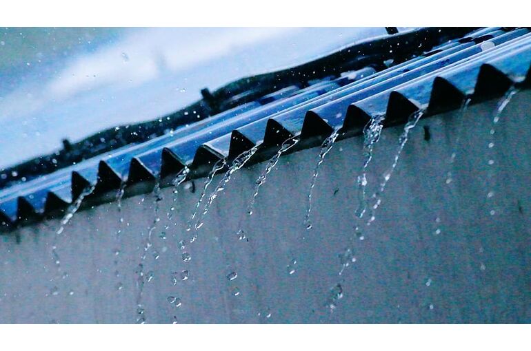 gray-roof-sheets-with-water